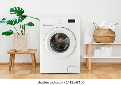 Clothes washing machine in laundry room interior