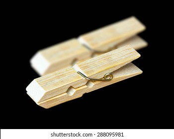 Clothespin isolated on a black background.