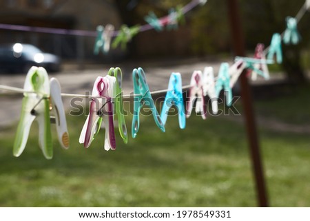 Similar – Image, Stock Photo Clothespins hanging on the line