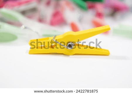 clothespins, clothes pegs, colorful plastic clothes pin, selective focus, blurry background