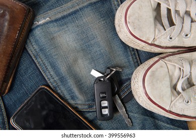 Clothing accessories , jeans sneaker smartphone leather wallet car key