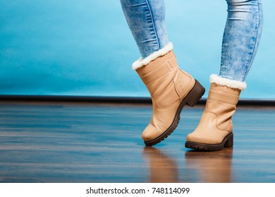 Clothing Fashion Concept. Autumnal Winter Warm Shoes On Female Legs. Stylish Footwear.