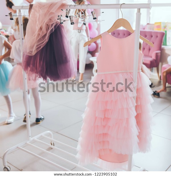 Clothing Little Girl On Clothes Rack Stock Photo Edit Now 1223905102