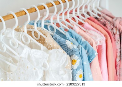 Clothing Rack With Children's Outfits Close Up. Home Kids Wardrobe. Nursery Storage Ideas. Baby Girl Clothes.