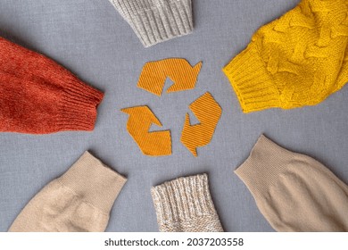 Clothing recycling. Used clothes. Ecological and sustainable fashion. sleeves of autumn woolen sweaters. reduce waste concept. High quality photo - Shutterstock ID 2037203558