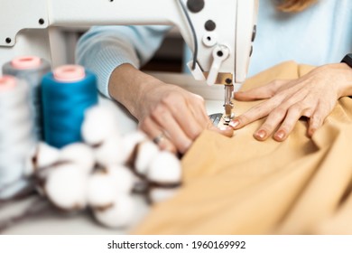 Clothing repair. Worker in a garment factory, fashionable and sustainable production. Fix dress. - Shutterstock ID 1960169992
