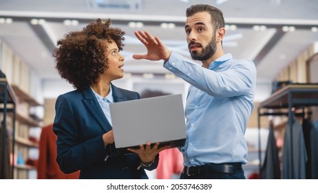 Clothing Store: Businesswoman Uses Laptop Computer, Talks to Visual Merchandising Specialist, Collaborate To Create Stylish Collection. Small Business Fashion Shop Sales Manager Talks to Designer. - Shutterstock ID 2053746389