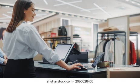 Clothing Store: Businesswoman and Visual Merchandising Specialist Uses Laptop To Create Stylish Collection. Fashion Shop Sales Retail Manager Checks Stock. Small Business Owner and Designer Works - Shutterstock ID 2060828435