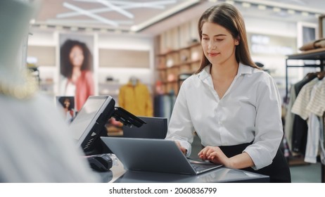 Clothing Store: Businesswoman and Visual Merchandising Specialist Uses Laptop To Create Stylish Collection. Fashion Shop Sales Retail Manager Checks Stock. Small Business Owner and Designer Works - Shutterstock ID 2060836799