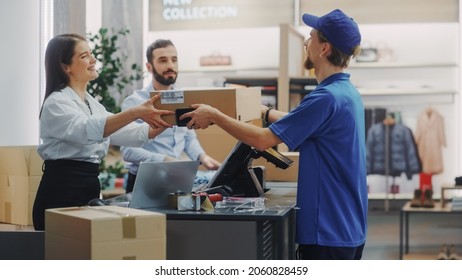 Clothing Store Checkout Cashier Counter: Female And Male Retail Sales ManagersGive Package To Online Order Delivery Person. Fashionable Shop, With Stylish Brand Designs Available On Internet