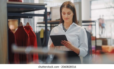 Clothing Store: Female Visual Merchandising Specialist Uses Tablet Computer To Create Stylish Collection. Fashion Shop Sales Retail Manager Checks Stock. Small Business Owner Orders Merchandise - Shutterstock ID 2060828516
