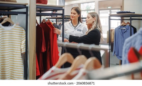 Clothing Store: Professional Sales Associate Talks With Beautiful Female Customer, Shopping For Stylish Clothes, Choosing Trendy And Sustainable Brands. Stylish Fashionable Shop In Shopping Mall