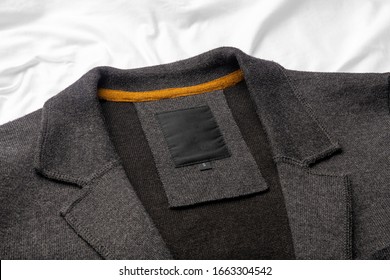 Clothing Tag, Label Blank Mockup Template, To Place Your Design. On A Grey Mens Jacket, Cardigan