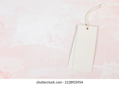 Clothing Tag, Label Blank Mockup Template On A  Pink Table