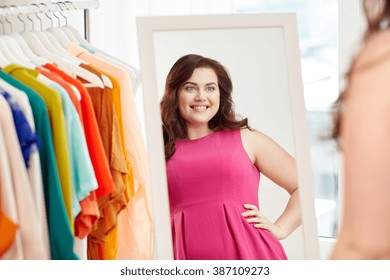 Clothing, Wardrobe, Fashion, Style And People Concept - Happy Plus Size Woman Posing At Mirror At Home