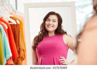 Clothing, Wardrobe, Fashion, Style And People Concept - Happy Plus Size Woman Posing At Mirror At Home