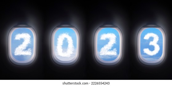 cloud 2023 outside the plane window for new year celebrate , four airplane windows open white window shutter wide with blue sky view and white cloud in 2023 shape - Shutterstock ID 2226554243