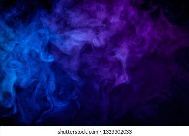 Cloud Of Blue Smoke On A Black Isolated Background. Background From The Smoke Of Vape
