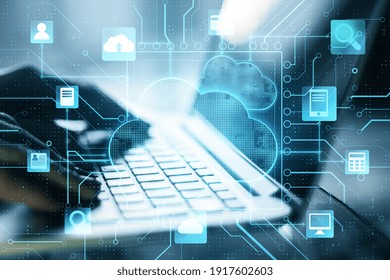 Cloud computer storage concept with digital screen with cloud service application items and fingers on laptop keyboard - Shutterstock ID 1917602603