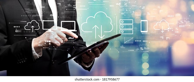 Cloud computing with businessman using his tablet computer