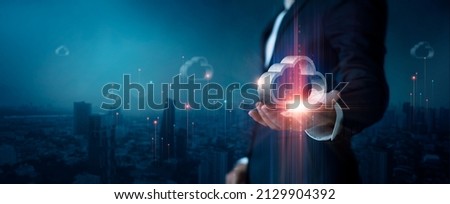 Cloud computing concept, Businessman hold cloud computing icon and connect to cloud data technology on global network connection with city background