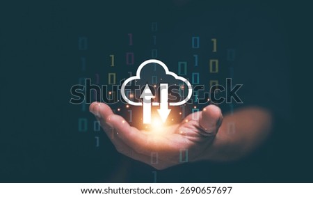 Cloud computing concept. Businessman holding glowing upload and download icons. Data transfer management, cloud storage, digital synchronization, information technology and online, connectivity.