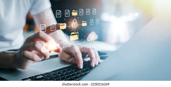Cloud computing concept. Businessman using computer to backup storage data Internet technology. backup online documentation database and digital file storage system or software, file access. Cloud..