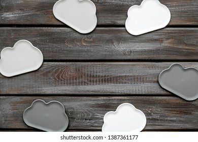 cloud computing concept with clouds on wooden background top view space for text
