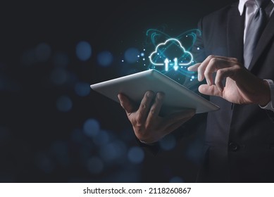 Cloud computing concept - connect devices to cloud. Businessman or information technologist with cloud computing icon and tablet, copy space for text.