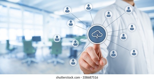 Cloud computing concept - connect office workers to cloud storage. Businessman click on cloud computing icon connected with corporate users working on notebooks. Wide banner, office in background. - Shutterstock ID 338687516