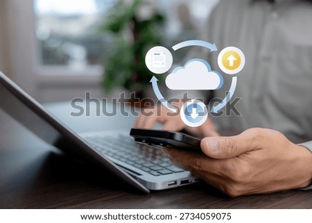 Cloud computing concept with digital icons showing data upload, download, and document sync above smartphone and laptop. Cloud storage, data transfer, backup, and business technology.