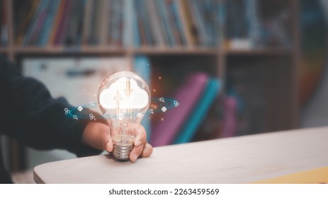 cloud computing concept, kids idea and cloud techonlogy, girl hand holding light bulb and icon show concept of kid and new technology