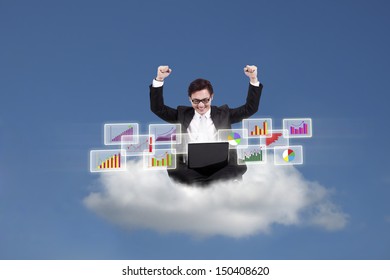 Cloud computing concept: Successful Asian businessman with laptop sitting on cloud