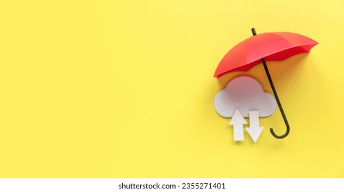 Cloud computing data storage concept.Network computing technologies. Digital server. Cyber security. Data protection.Icon of cloud with arrow on yellow background under a red umbrella.