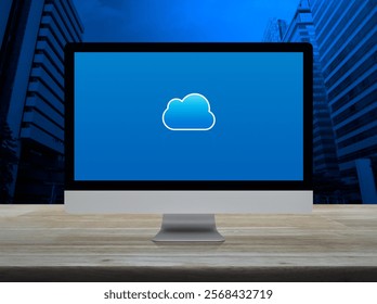 Cloud computing icon on desktop modern computer monitor screen on wooden table over office city tower and skyscraper, Technology cloud computing concept