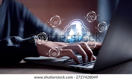 Cloud computing interface with upload and download symbols highlights digital storage solutions, real-time data sync, and smart business technology, operated via laptop for seamless online access.
