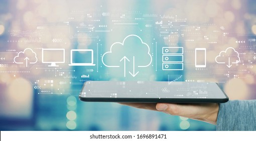 Cloud computing with man holding a tablet computer