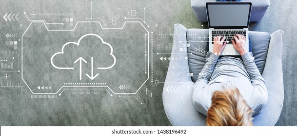 Cloud Computing With Man Using A Laptop In A Modern Gray Chair