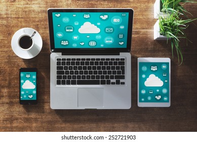 Cloud computing and social network interface on a laptop, tablet and smartphone screen - Powered by Shutterstock