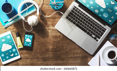 Cloud computing and social network interface on a laptop, tablet and smart phone screen - Powered by Shutterstock