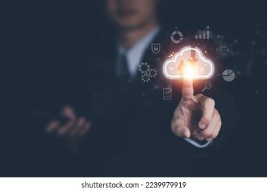Cloud computing technology concept with businessman. Big data analytics and business intelligence concept with chart and graph icons on a digital screen interface. - Shutterstock ID 2239979919