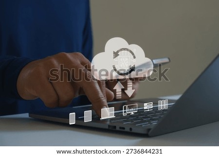 Cloud computing technology concept. Businessman using laptop and smartphone, data synchronization, digital transformation, online storage, cybersecurity, modern IT infrastructure network solutions.