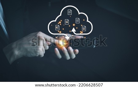 Cloud computing technology concept. Internet storage network system. Bigdata and business. Man wearing black suit and Finger touch smartphone.