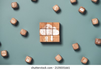 Cloud computing and technology icons print on wooden cube bock , cloud technology is centralise collect lifestyle and confidential information such as internet banking , password and shopping.