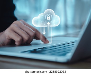 Cloud computing technology management concept. Cloud with digital lock icons appearing while business people working with laptop computer, transfer data by finger on touchpad. Protection and security.