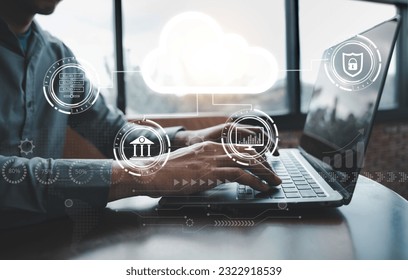 Cloud computing technology on display as a businessman uses a laptop to access data storage and networking services, a concept for global businesses.