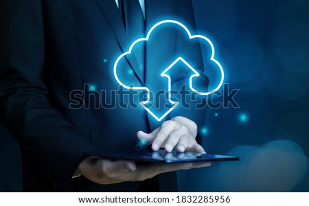 Cloud computing technology and online data storage for global data sharing. Computer connects to internet network server service for cloud data transfer presented in 3D futuristic graphic interface.