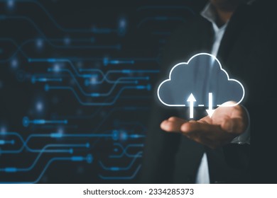 Cloud Computing,Data storage concept.,Businessman holding cloud storage icon over technology background perfect for business network,IOT idea.