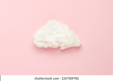 Cloud Of Cotton Wool On A Pink Background. Concept Of Rain, Rain. Flat Lay, Top View.