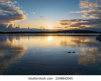 A cloud covered sunrise waterscape at Woy Woy on the Central Coast, NSW, Australia. - Shutterstock ID 2248842045